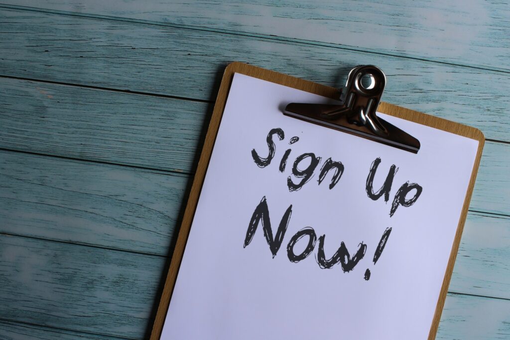 Paper clipboard with text Sign Up Now!
